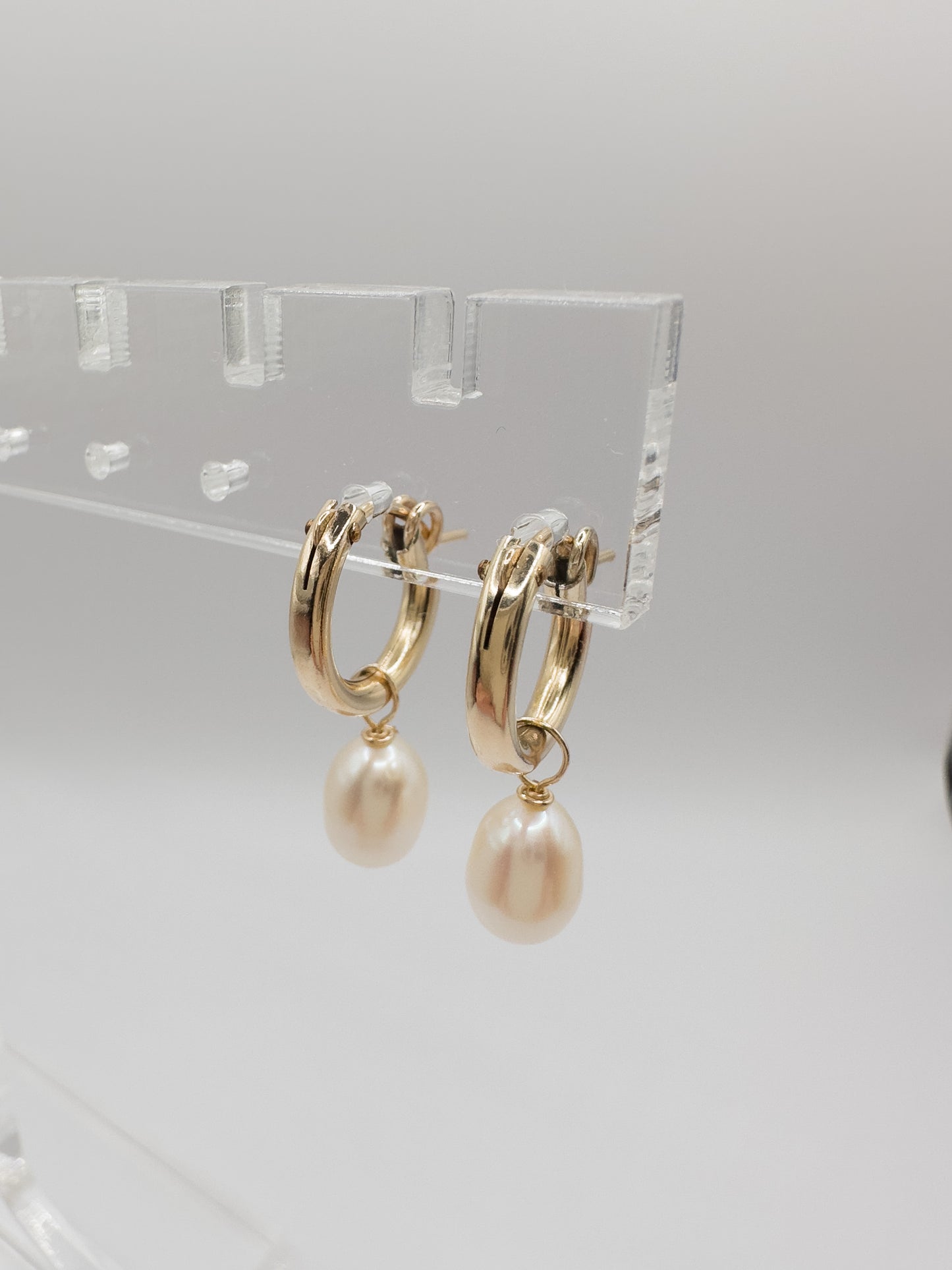 OS gold filled & pearl huggie hoop earrings.