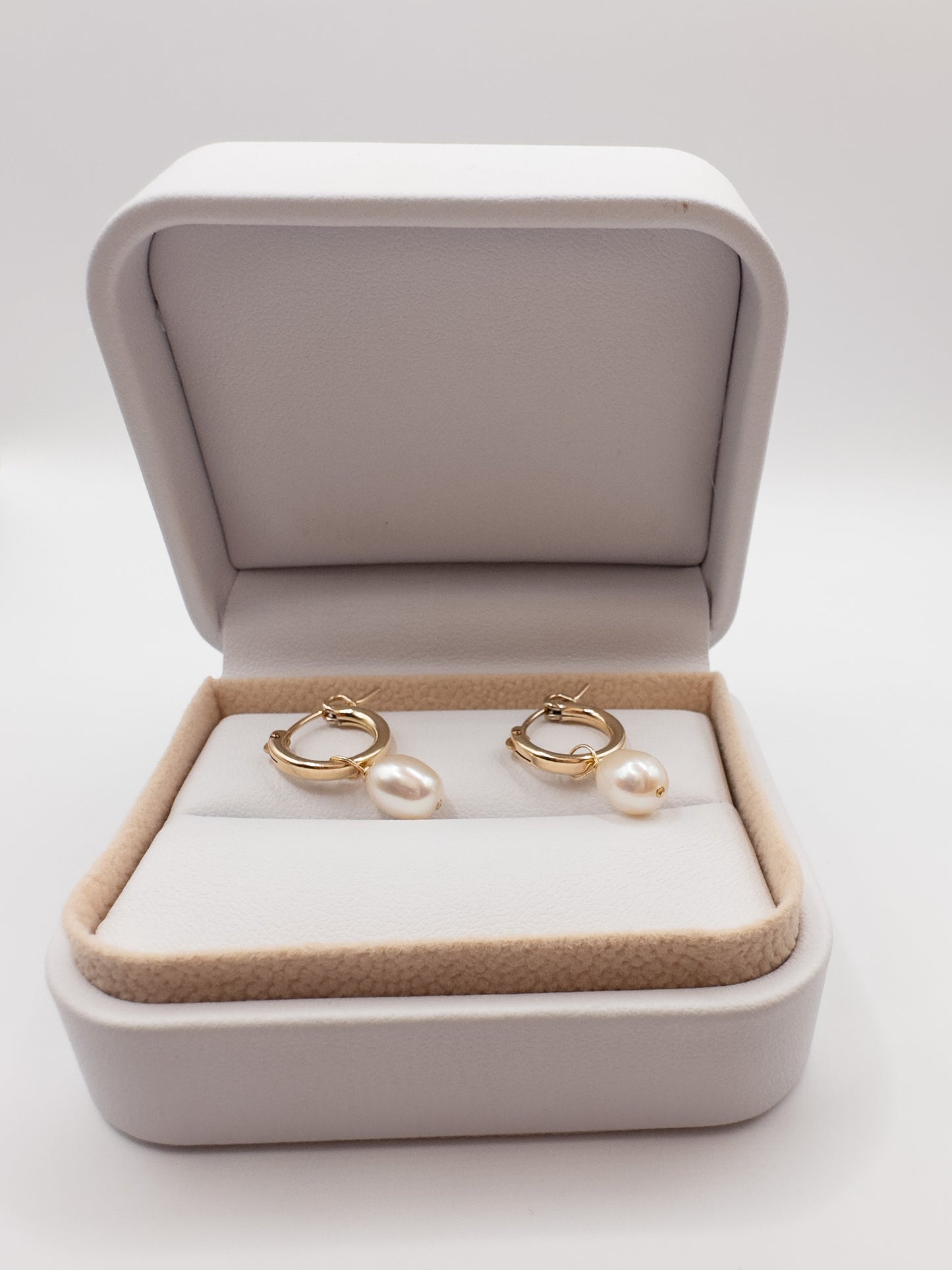 OS gold filled & pearl huggie hoop earrings.