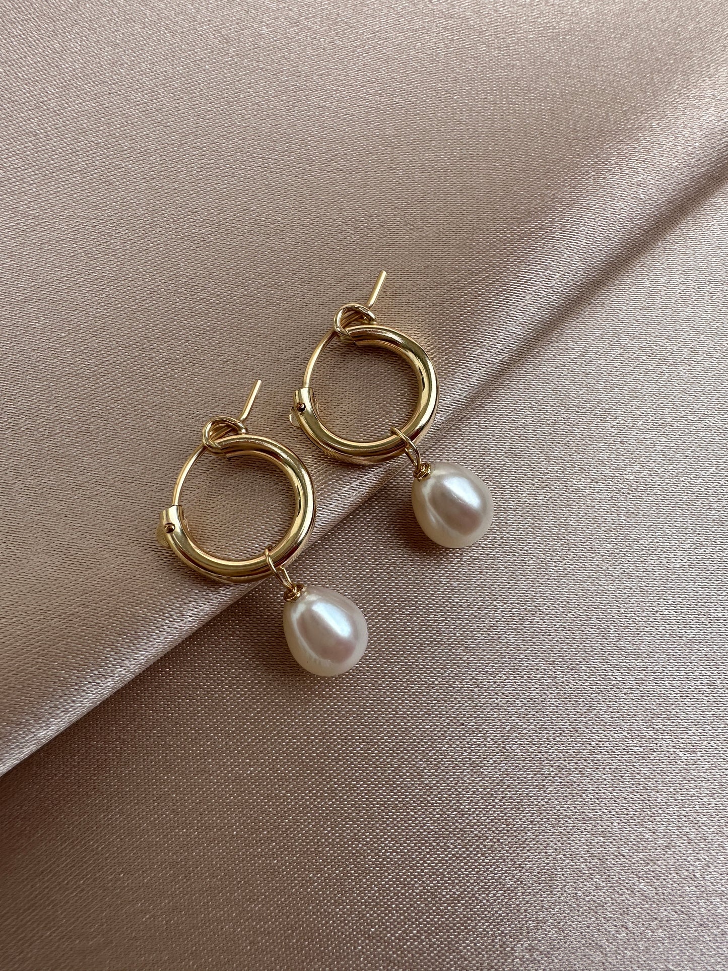 OS gold filled & pearl huggie hoop earrings.