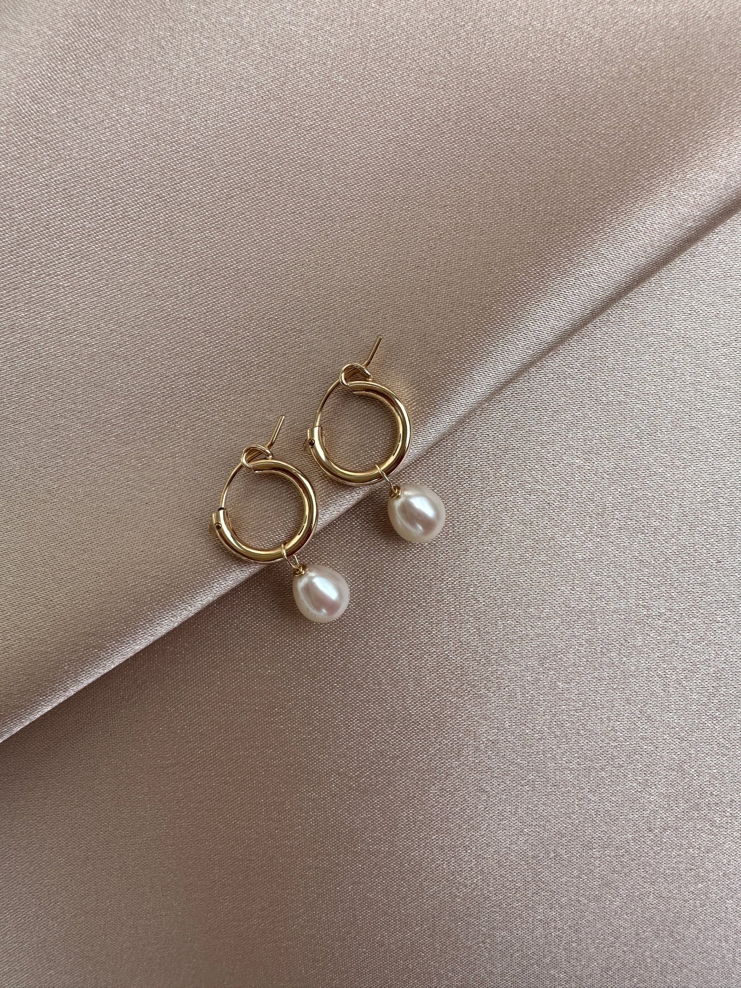 OS gold filled & pearl huggie hoop earrings.